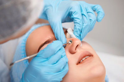 Close-up of doctor examining patient