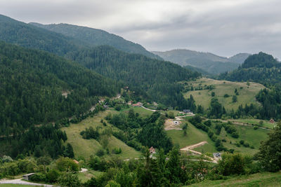 Scenic view of landscape and mountains against sky