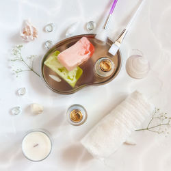  a table with cosmetics and accessories for a face care treatment. me time, spring rejuvenation
