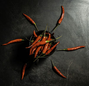 High angle view of chili peppers on table