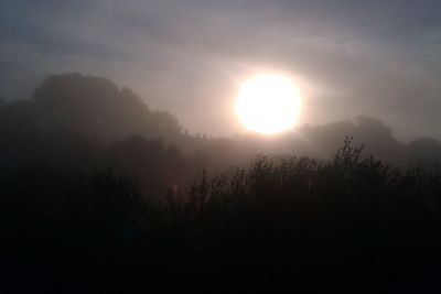 Sun shining through clouds