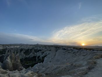 Scenic view of snowcapped mountains against sky during sunset