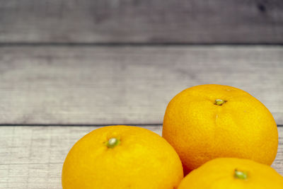 Close-up of oranges on table