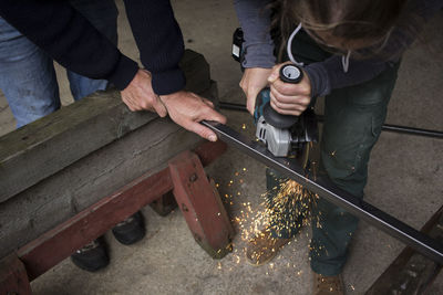 Midsection of woman working at workshop