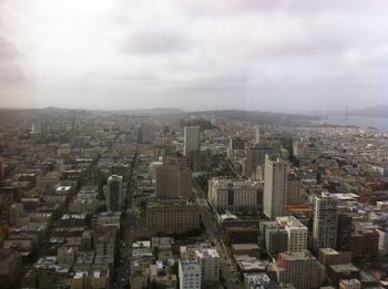 High angle view of modern buildings in city against sky