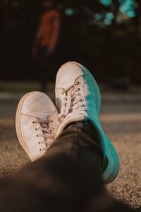 Low section of person wearing canvas shoes