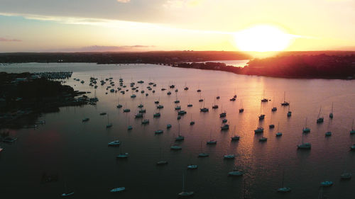 High angle view of sea against sky during sunset