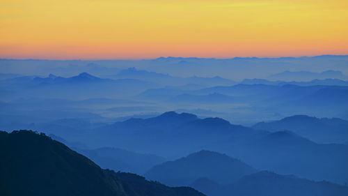 Scenic view of mountains against sky during sunset