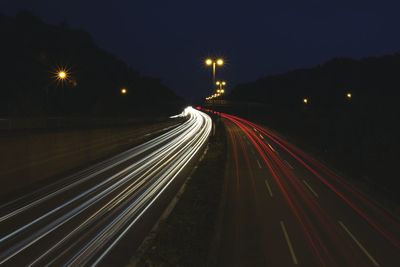 High angle view of light trails on road at night