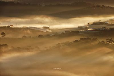 Aerial view of landscape against sky during sunset