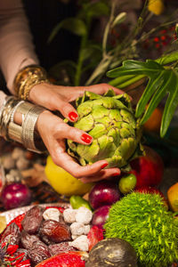Close-up of woman holding fruit