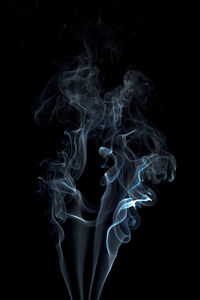 Close-up of smoke against black background