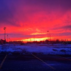 Snow covered landscape at sunset