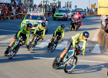 People riding bicycle on city street