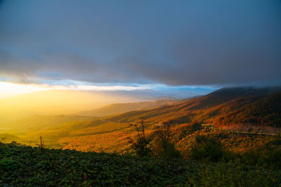 Scenic view of landscape against sky during sunset