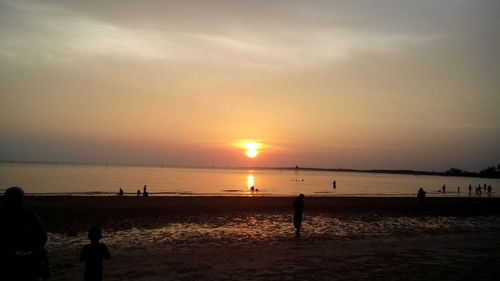 Scenic view of beach during sunset