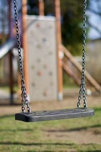 Close-up of swing at playground