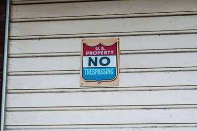 Close-up of warning sign on wall