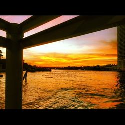 Scenic view of river at sunset