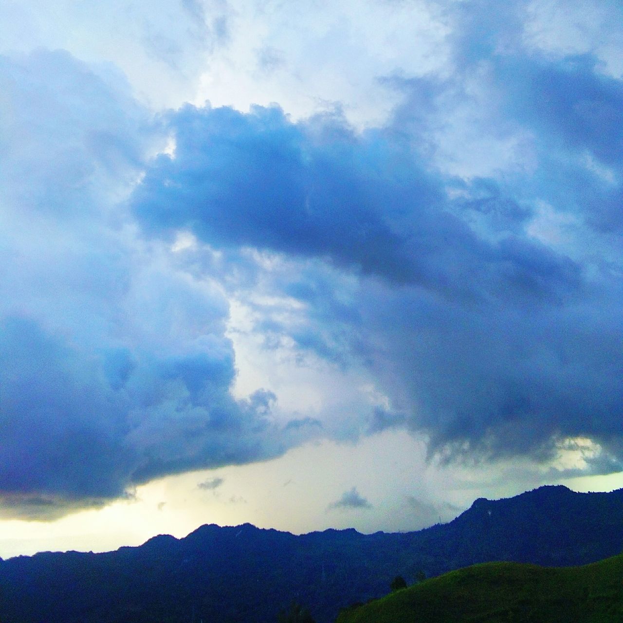 MOUNTAINS AGAINST SKY