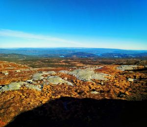 Aerial view of cityscape by sea against sky