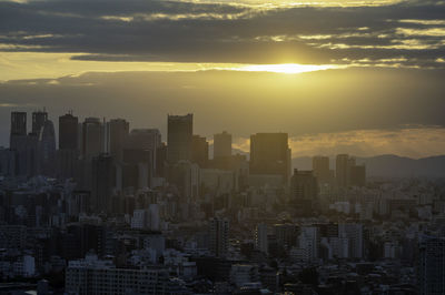 Cityscape against sky during sunset