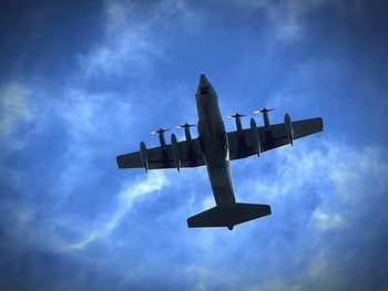 Low angle view of airplane against sky