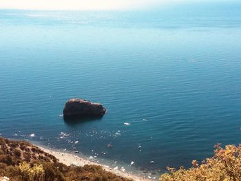 High angle view of rocks on sea