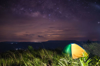 Scenic view of field against sky at night