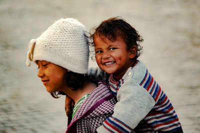 Portrait of mother and son on beach