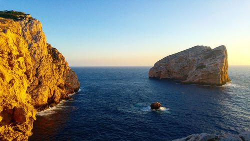 Scenic view of sea against sky at sunset