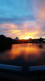 Scenic view of silhouette trees against sky at sunset