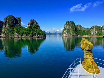 Scenic view of lake against blue sky