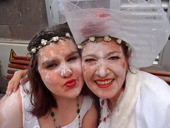 Portrait of smiling women covered in flour