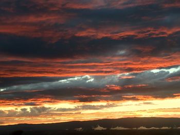 Low angle view of dramatic sky during sunset