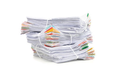 Stack of paper against white background