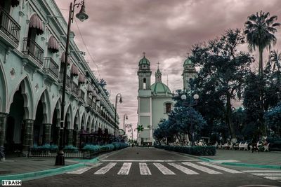 View of buildings against cloudy sky