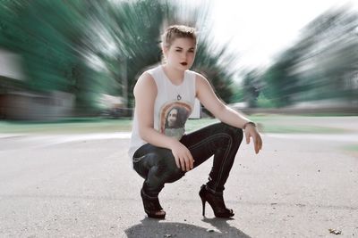 Full length of woman standing on road