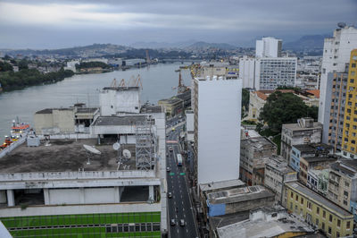 High angle view of buildings and street against sky