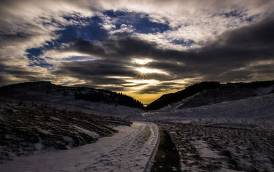 Scenic view of road against sky during sunset