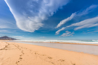 Scenic view of beach against sky