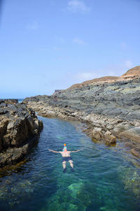 Scenic view of sea against blue sky