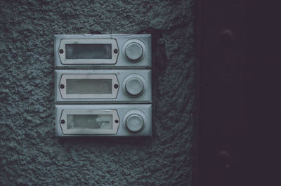 Close-up of telephone booth on wall