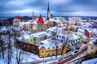 High angle view of town against cloudy sky