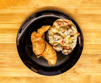 High angle view of meat in plate on table