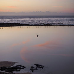 Scenic view of sea at sunset