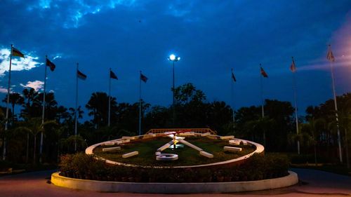 Scenic view of fountain against sky at night