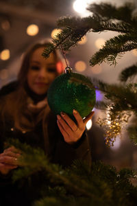 Woman holding christmas tree