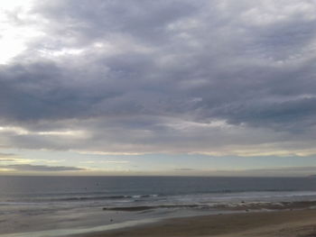 Scenic view of beach against sky during sunset