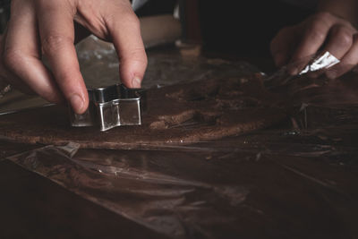 Midsection of person preparing food on table